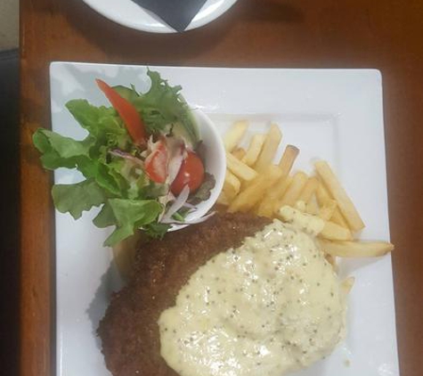 Alma Hotel - Willunga, SA. My beef porterhouse schnitzel with garlic sauce