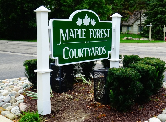 Donner Signs - South Lyon, MI. This entrance sign is double sided 3mm alupanel face material with custom posts consisting of western red cedar wrapped with 1/2" extira board for great apperance