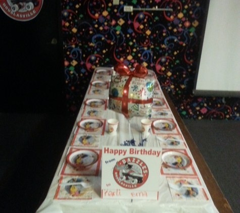 Dazzles Rollersports - Douglasville, GA. The birthday party area looks fun and festive. Very affordable too.