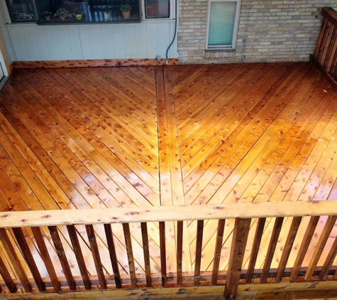 Decks and Stuff - Garland, TX. Diagonal deck with breaker board made with cedar freshly stained and a handrail