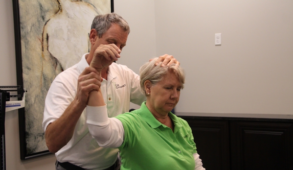 Club Chiropractic - Greensboro, NC. Dr. Tom Monaghan and patient