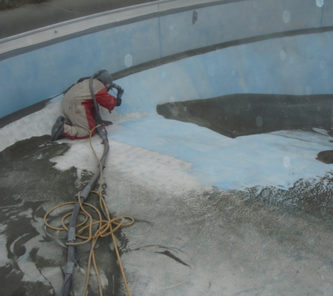 Knauss Property Services - Indianapolis, IN. Swimming Pool - Sandblasted, fixed cracks and painted.