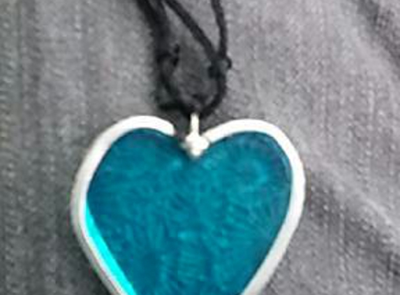stained glass hearts four humanity - las vegas, NV. < 2 inches plain decorator glass
non lead came,sterling silver bail,adjustable cord $23.00
