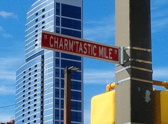 Light Street Owner - Baltimore, MD. 414 Light Street in the backdrop of the Iconic "Charm'tastic Mile" street sign.