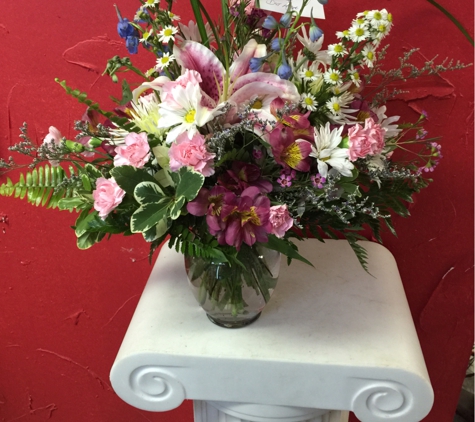 A Touch Of Class Florist - Vestavia, AL. Small vase cut of pastel mixed holland and common flowers