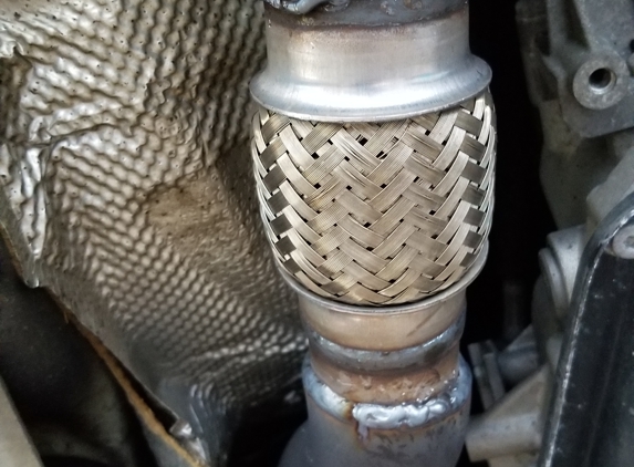 USM Discount Muffler Brake - Danbury, CT. Shot of the fine work on my Audi (flex pipe welding)
