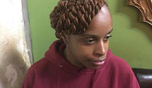 Astou inside The New Afrogenix Braiding Salon - Dallas, TX. Ask Astou about Ghana Braids