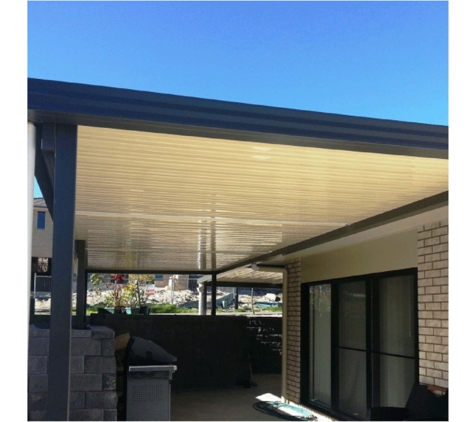 Judds Garages - Edgeworth, NSW. Attached Flat Roof Awning - Custom Design To Suit Your Needs