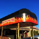 Men Wielding Fire Restaurant - Family Style Restaurants
