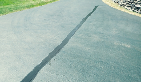 Roadmark Industries - Auburn, ME. Hot rubberized crack filler