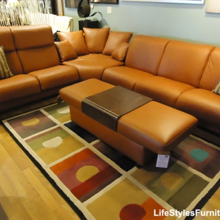 Lifestyles Furniture - Davenport, IA. Stressless sectional with high-back loveseat and low-back sofa shown with double ottoman.
