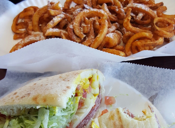 Brickhouse Dracut - Dracut, MA. Italian on pita. The order of curly fries is so large it comes on 2 plates. The pita is huge to as it fills a whole plate. No skimping!!