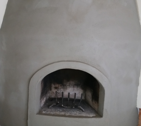 Building Block Masonry - Phoenix, AZ. Interior masonry fireplace with a sand finish stucco