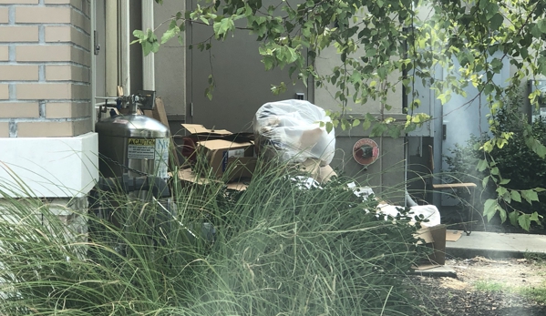 Chipotle Mexican Grill - Kansas City, MO. Pile of trash and boxes at the back door