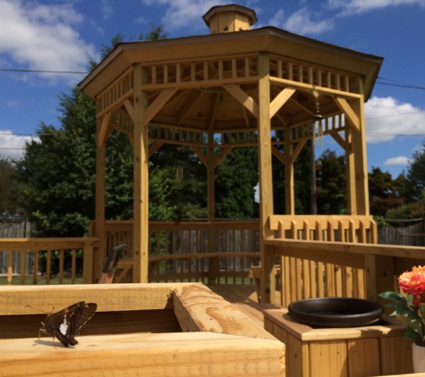 Install America - Mohnton, PA. New deck with gazebo, bench seating with built in storage, and planter boxes. Built by Install America.