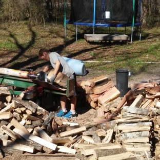 Hickmon's Wood Yard - Coldspring, TX. The whole family hard at work