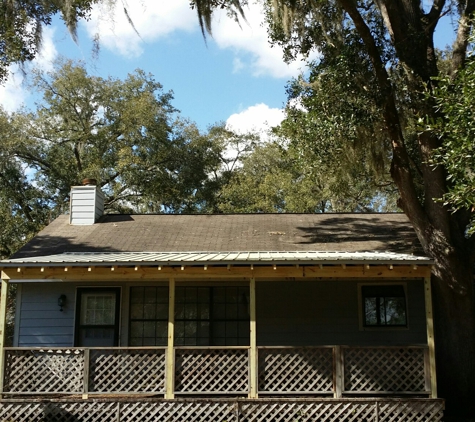 Fiveash Renovations - Brunswick, GA. A porch we built 2x6 roof with Ash gray ruff rib metal roofing to help keep leaves off the porch and provide more shade.