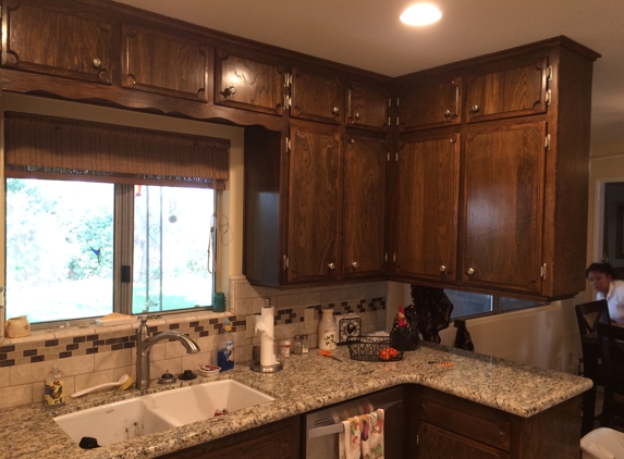 Painter & Wallpaper Hanger - Clovis, CA. Touch up stain on these kitchen cabinets and re lacquer.