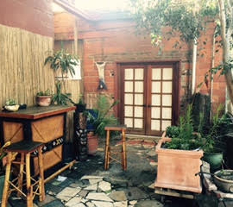 City of Paris Studios - Emeryville, CA. Tiki bar in City of Paris shared garden courtyard