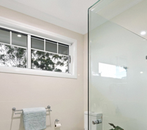 Bradnam's Windows & Doors - Warana, QLD. Frameless Shower Screen - Corner Configuration