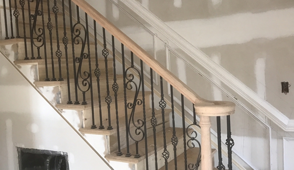 Impact Home Improvement. interior stair and railings with metal balusters