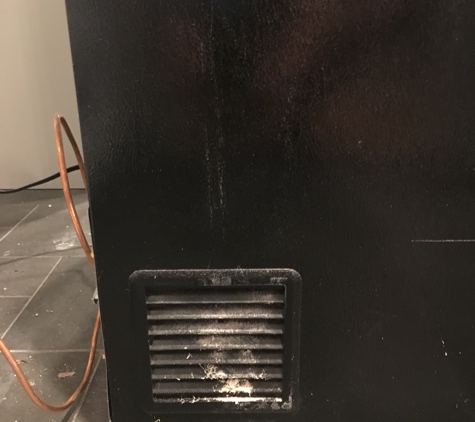 Creative Contracting - North Wales, PA. This is how the new refrigerator was installed with dented/scratch that they offered to touch up paint.