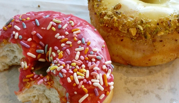 Revolution Doughnuts - Decatur, GA. Raspberry Sprinkle Donut and Pistachio Glazed