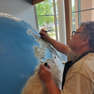 Universal Fine Art - Estill, SC. Dimitri painting the globe