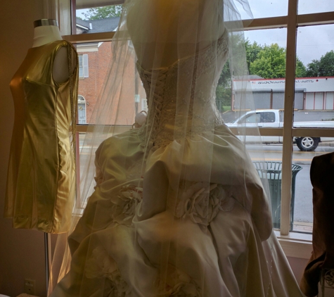 SilverWing Sewing & Alterations - Hamilton, OH. Wedding gown featuring floral bustles, corset back, custom made bridal veil