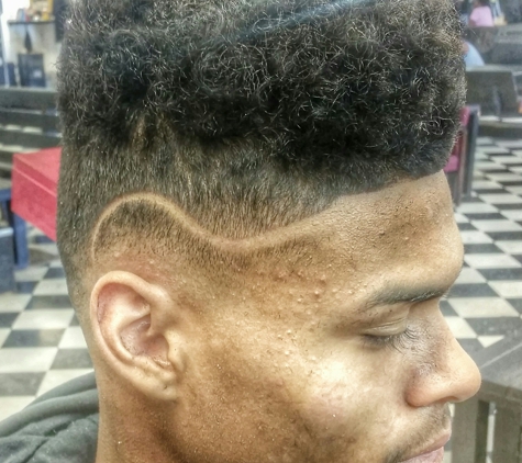 Adrian The Barber - Tulsa, OK. Simple part w/ fade 
Book now 
Adrianthebarber.genbook.com