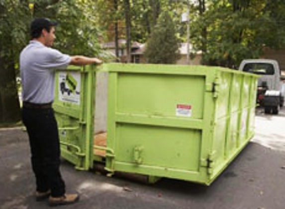 Bin There Dump That. Hinged doors on the back of all of our dumpsters for easy loading.