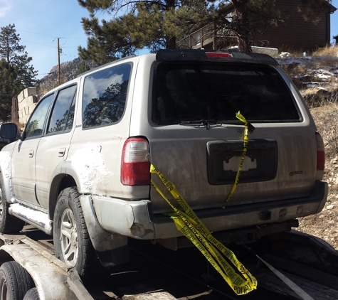 Father & Son  Towing - Littleton, CO. Down in cliff 100 feet