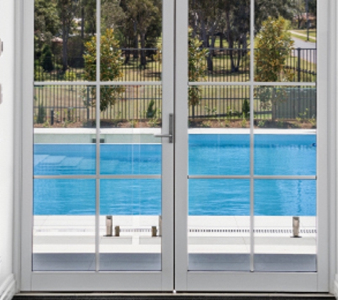Bradnam's Windows & Doors - Bungalow, QLD. White Aluminium Hinged Door With Colonial Bars