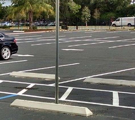 Arrow  Pavement Services Inc - Orlando, FL. New Sealcoat & stripe