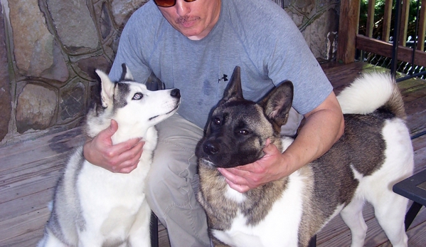 Arlington Animal Hospital - Poughkeepsie, NY. My husband with our dogs, the Husky and the Akita - 2013