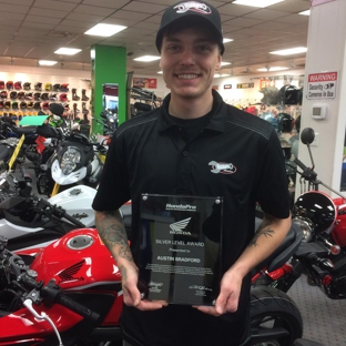 Fun Products Inc - Goldsboro, NC. Austin Bradford is all smiles while showing off his Honda Award!