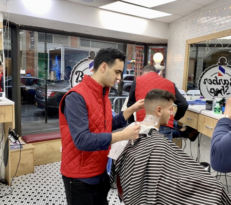 Barber Shop NYC - New York, NY. Barbers in action at Barber Shop NYC