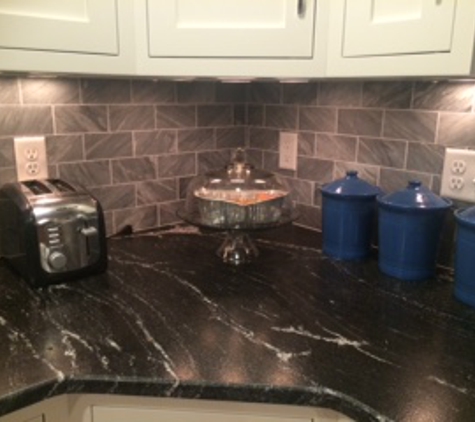 Fleming Tile & Marble Inc - Willow Street, PA. Leather finish granite that looks like soapstone!  Gorgeous honed marble backsplash