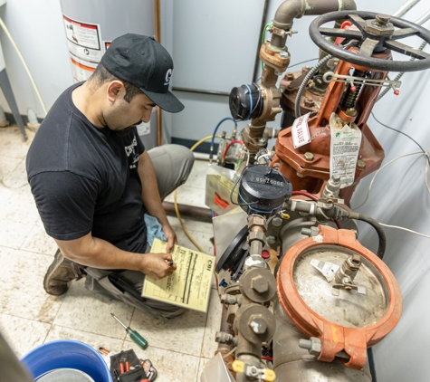 Chicago Backflow Inc - Alsip, IL. Chicago Backflow licensed tester, testing a large backflow assembly