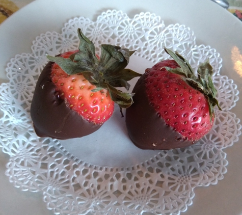 Breakfast Club - Royal Oak, MI. The Breakfast Club also gives everyone some chocolate dipped strawberries with the check. You get one chocolate dipped strawberry to each person at your table. Very impressive.