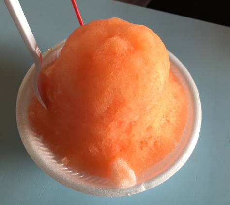 Waiola Shave Ice - Honolulu, HI. POG (passion fruit, orange, and guava) shaved ice with ice cream on the bottom.