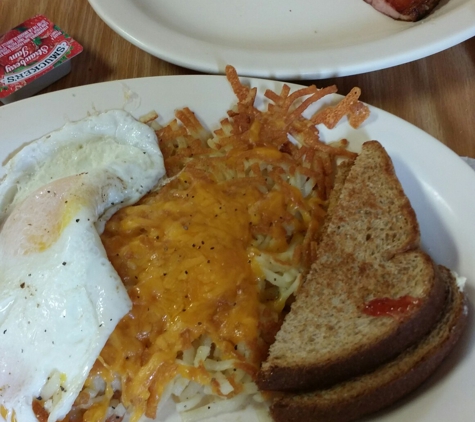 Anchor Cafe - Atmore, AL. Breakfast with grits or hashbrowns. And real country ham. Look at the size of the ham, and that is a half order. Can't br beat.