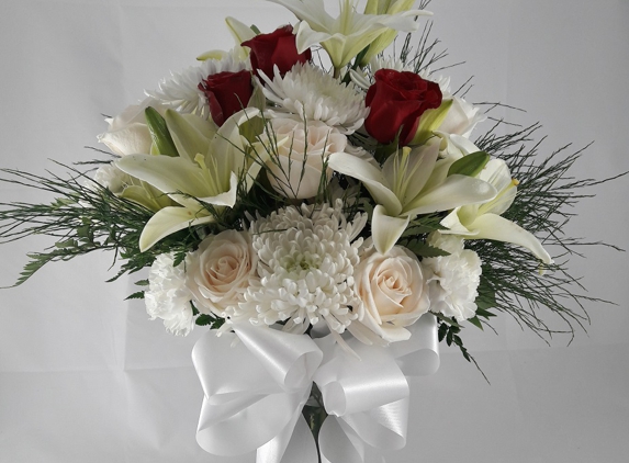 Buds & Bows Floral Design. For Funeral with Red Roses... Our hearts in the Center...  Perfect!