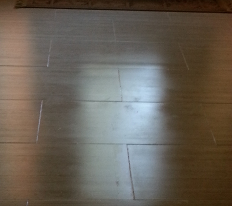 Tell-Projects - Houston, TX. Blotchy sealer located in the center of my foyer, right in front of my front door.