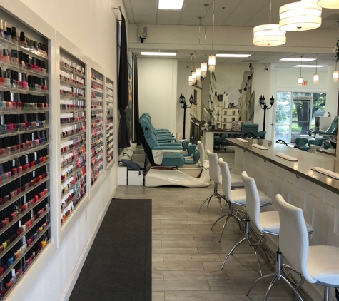 Platinum Nail Lounge - Santa Rosa, CA. Wall of polishes and manicure stations