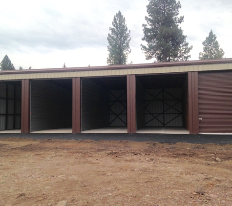 Lone Larch Storage - Seeley Lake, MT. All large units are 32' deep.  Door width is either 12' or 10'. Door height is 14' and overall unit width is either 12' or 14'.