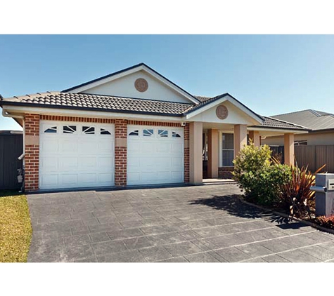 Schofield's Garage Doors - Robertson, NSW. You will be delighted by the look and enhanced security a new garage door can bring to your home.