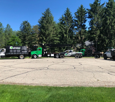Quinlan Tree Service - Milford, MI. Quinlan Tree Service Fleet of Trucks