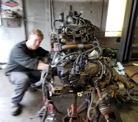 Schultz Garage - Petersburg, OH. Eric, hard at work on an engine!