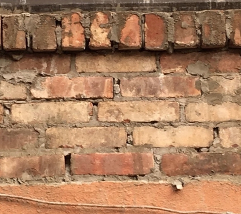 Champion 1 Construction - Floral Park, NY. new brick wall constructed for a historic Brooklyn row house